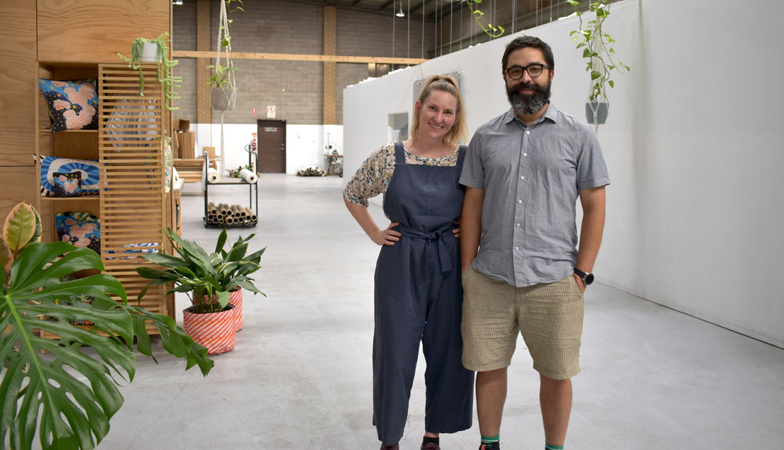 Next State founders Chole and Geoff standing in the foyer of Next State production facility
