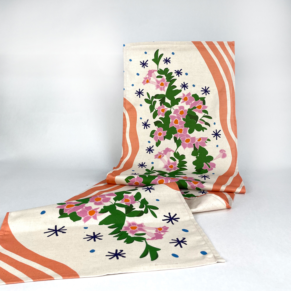 a custom printed table runner with a modern floral design