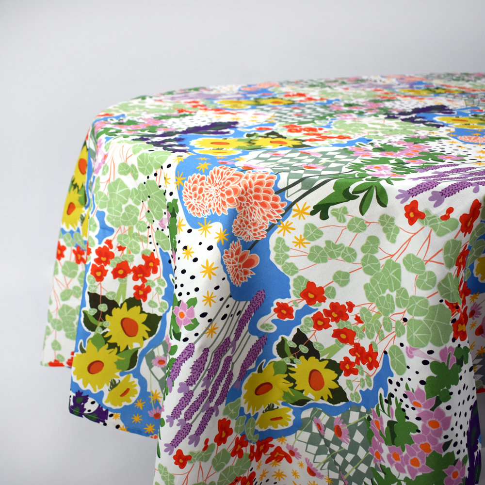 Custom printed table cloth photo on a table with a floral print.