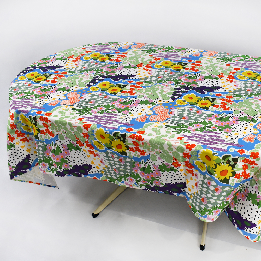 floral table cloth custom printed by next state on a table with a white background