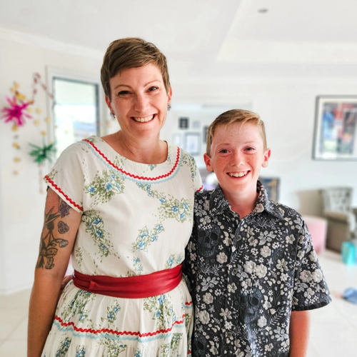 Kathryn Shaw of brand Rattamatatt with her Son standing in the lounge at home