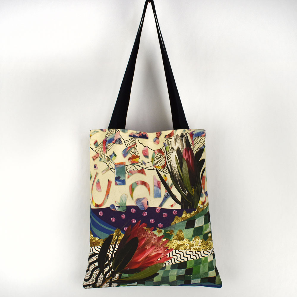 A tote bag hanging with a full cover custom print of a floral collage